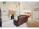 Spacious living room with high ceilings, a fireplace, and seamless access to the kitchen at 4549 Clarks Creek Ter, Ellenwood, GA 30294