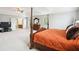 Bedroom featuring a four-poster bed and entry into an ensuite bathroom at 4549 Clarks Creek Ter, Ellenwood, GA 30294