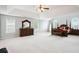 A spacious main bedroom with tray ceiling, ceiling fan, and decorative furniture set at 4549 Clarks Creek Ter, Ellenwood, GA 30294