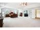 Large main bedroom featuring a four-poster bed, ceiling fan and entry to media room at 4549 Clarks Creek Ter, Ellenwood, GA 30294