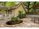Backyard with pond surrounded by mature plants at 1290 Mclendon Ne Ave, Atlanta, GA 30307