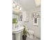 Cozy, well-lit bathroom featuring sink, toilet, and shower with modern finishes at 1290 Mclendon Ne Ave, Atlanta, GA 30307
