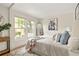 Bright bedroom with a bed, a large window view, and modern decor at 1290 Mclendon Ne Ave, Atlanta, GA 30307