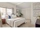 Cozy bedroom with neutral tones, a comfortable bed, and an ensuite closet at 1290 Mclendon Ne Ave, Atlanta, GA 30307