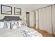 Comfortable bedroom featuring a bed, modern decor, and hardwood floors at 1290 Mclendon Ne Ave, Atlanta, GA 30307