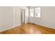 Bright bedroom featuring hardwood floors, double-hung windows and neutral paint scheme at 1290 Mclendon Ne Ave, Atlanta, GA 30307