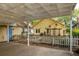 Spacious carport attached to a charming yellow home, providing covered parking and easy access at 1290 Mclendon Ne Ave, Atlanta, GA 30307