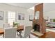 The dining room boasts a central brick fireplace and dining room set, creating a warm and inviting space at 1290 Mclendon Ne Ave, Atlanta, GA 30307
