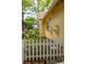 Charming side view with hydrangea bushes and a white picket fence, enhancing the home's curb appeal at 1290 Mclendon Ne Ave, Atlanta, GA 30307