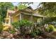 A well-maintained home featuring a manicured yard and a charming front porch with stone pillars at 1290 Mclendon Ne Ave, Atlanta, GA 30307