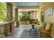 Relaxing front porch with comfortable seating, a swing, and stylish decor, perfect for enjoying the outdoors at 1290 Mclendon Ne Ave, Atlanta, GA 30307