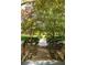 Stone stairway leading to a property, framed by trees and hedges, offering a serene approach at 1290 Mclendon Ne Ave, Atlanta, GA 30307