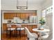 Well-lit kitchen with stainless steel appliances, breakfast bar, and adjacent dining space, perfect for gatherings at 1290 Mclendon Ne Ave, Atlanta, GA 30307
