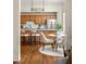 Eat-in kitchen features stainless appliances, custom cabinets, and hardwood floors, exuding warmth and character at 1290 Mclendon Ne Ave, Atlanta, GA 30307