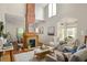 Bright living room featuring a fireplace, comfortable seating, and large windows, designed for relaxation and style at 1290 Mclendon Ne Ave, Atlanta, GA 30307