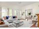 Open-concept living room with a cozy seating arrangement and a view into the dining area at 1290 Mclendon Ne Ave, Atlanta, GA 30307