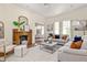 Comfortable living room featuring a brick fireplace, plush seating, and stylish decor at 1290 Mclendon Ne Ave, Atlanta, GA 30307