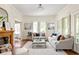 Cozy living room with a wood-burning fireplace, comfortable seating, and stylish decor at 1290 Mclendon Ne Ave, Atlanta, GA 30307