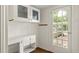 Functional mud room with built-in cabinets and a rear door leading to the yard at 1290 Mclendon Ne Ave, Atlanta, GA 30307