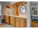 Bathroom featuring dual vanity sinks with white countertops and wood cabinets at 15 Walnut Ridge Way, Covington, GA 30014