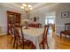 Traditional dining room with hardwood floors and decorative chandelier at 15 Walnut Ridge Way, Covington, GA 30014