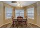 Dining room with a window view and a table with four chairs at 15 Walnut Ridge Way, Covington, GA 30014