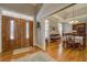 Elegant foyer with hardwood floors, decorative rug, and dining room view at 15 Walnut Ridge Way, Covington, GA 30014