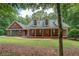 Charming brick home featuring a well-manicured front yard and classic design at 15 Walnut Ridge Way, Covington, GA 30014