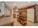 Kitchen featuring light brown cabinets and modern appliances at 15 Walnut Ridge Way, Covington, GA 30014