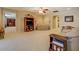 Comfortable living room with neutral carpet, a cozy sofa, and a vintage entertainment center at 15 Walnut Ridge Way, Covington, GA 30014