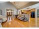 Open-concept living area showcasing hardwood floors connecting to the kitchen and front entry at 15 Walnut Ridge Way, Covington, GA 30014
