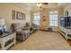 Living room with two armchairs and a tray ceiling at 15 Walnut Ridge Way, Covington, GA 30014