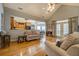Bright living room with hardwood floors offering seamless access to the kitchen and outdoor area at 15 Walnut Ridge Way, Covington, GA 30014