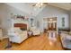 Comfortable living room featuring hardwood floors, fireplace, and an open layout towards the entry at 15 Walnut Ridge Way, Covington, GA 30014
