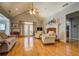 Spacious living room with a vaulted ceiling, hardwood floors, fireplace, and ample seating area at 15 Walnut Ridge Way, Covington, GA 30014