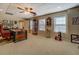 Bright office space featuring a traditional desk, display case and big windows for natural light at 15 Walnut Ridge Way, Covington, GA 30014