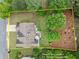Aerial view of a home highlighting the spacious backyard, landscaping and property lines at 214 Crestmont Way, Canton, GA 30114