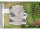 Aerial view of the home highlighting the roof, patio area, and surrounding greenery at 214 Crestmont Way, Canton, GA 30114