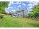 Spacious backyard with mature trees and landscaping, perfect for outdoor activities and entertaining at 214 Crestmont Way, Canton, GA 30114