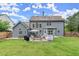 Large backyard with a patio area featuring outdoor furniture, a grill, and a trampoline at 214 Crestmont Way, Canton, GA 30114