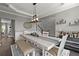 Dining room with modern decor and a rustic table accompanied by chairs and a bench at 214 Crestmont Way, Canton, GA 30114