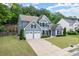 Stylish two-story home with lush lawn, attached two-car garage and inviting curb appeal at 214 Crestmont Way, Canton, GA 30114