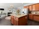 Gourmet kitchen with custom wood cabinets, stone countertops, an island, and stainless steel appliances at 214 Crestmont Way, Canton, GA 30114