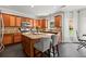 Gourmet kitchen with custom wood cabinets, stone countertops, an island, and stainless steel appliances at 214 Crestmont Way, Canton, GA 30114
