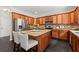 Gourmet kitchen with custom wood cabinets, stone countertops, an island, and stainless steel appliances at 214 Crestmont Way, Canton, GA 30114