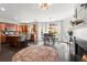 Open kitchen and dining area with stainless steel appliances and granite countertops at 214 Crestmont Way, Canton, GA 30114
