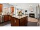 Eat-in kitchen with stainless appliances, wood cabinets, granite countertops, and an adjacent dining nook at 214 Crestmont Way, Canton, GA 30114