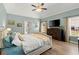Inviting main bedroom with a ceiling fan, light-colored walls, and plush bedding at 214 Crestmont Way, Canton, GA 30114