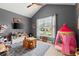 Play room with toys, a TV, and a vaulted ceiling at 214 Crestmont Way, Canton, GA 30114