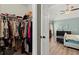 View of the main bedroom walk-in closet full of clothes and accessories, promoting easy organization at 214 Crestmont Way, Canton, GA 30114